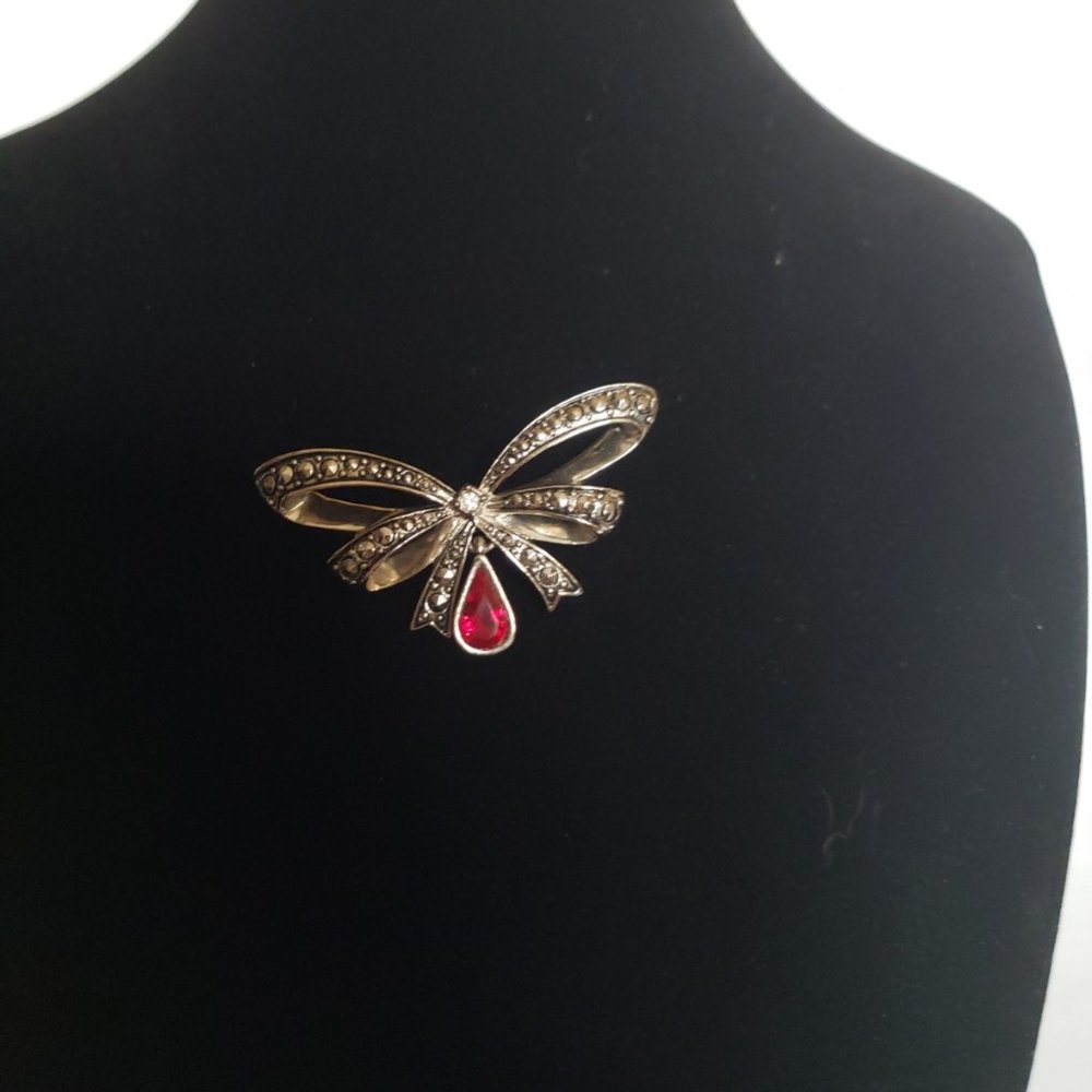 Vintage Avon brooch measures 2 inches by 1 inch made of metal and Marcasite